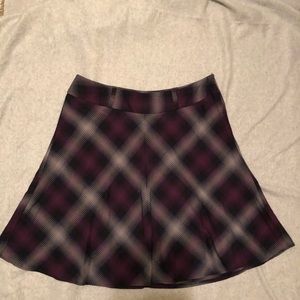 NYCO knee length purple plaid skirt.